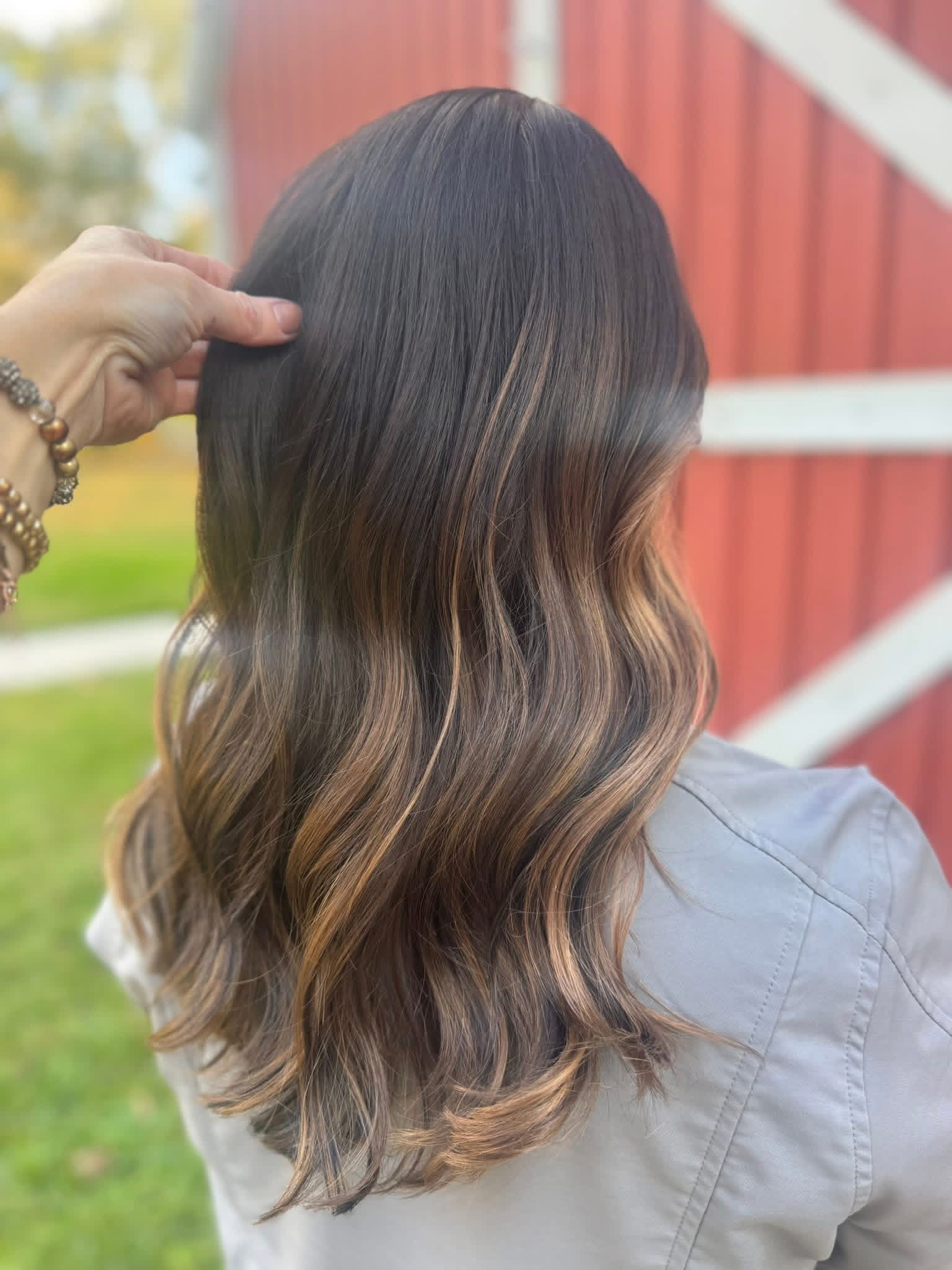 Long brunette hair with soft, blended waves